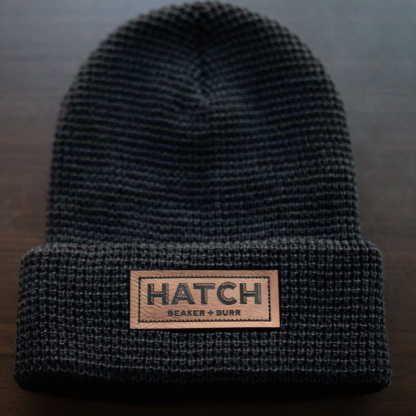 Charcoal waffle-knit beanie with a Hatch Beaker + Burr leather patch
