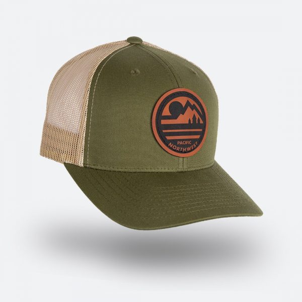 Olive and khaki trucker hat with a round Pacific Northwest leatherette patch