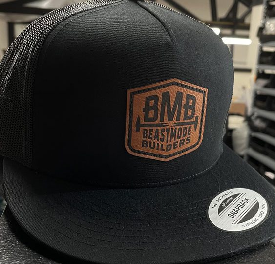 Black trucker hat with a BMB Builders leather patch